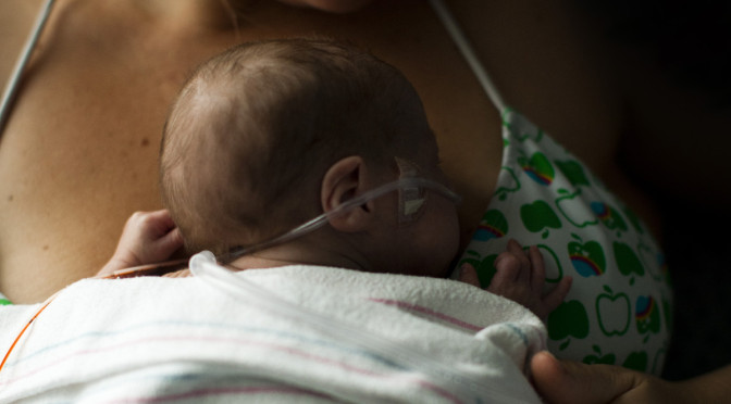 mom holding baby for skin-to-skin contact